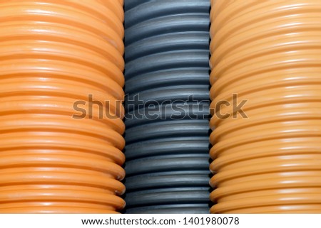 Plastic corrugated pipes for water supply, sewage, plumbing. Royalty-Free Stock Photo #1401980078