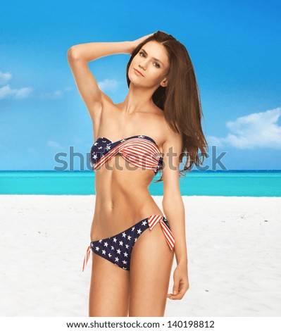 picture of happy smiling woman in bikini with american flag.