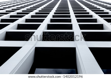 Abstract skyscraper looking up from street level with windows