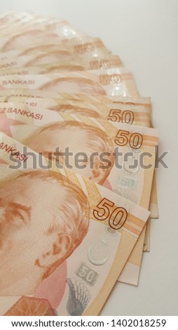 fifty turkish lira and metal turkish lira on a white background