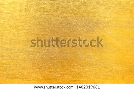 Shiny gold painted on wood wall in delicate line patterns for texture or background , horizontal