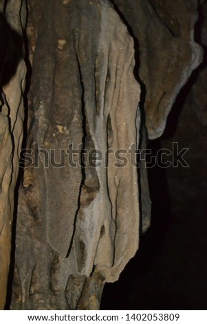 Stalactite of Pindul Cave. Stalactite is a type of secondary mineral (speleothem) that hangs on the ceiling of a limestone cave. blur picture