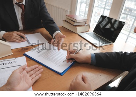 businessman signing contract agreement with realtor. buying, selling & renting real estate property