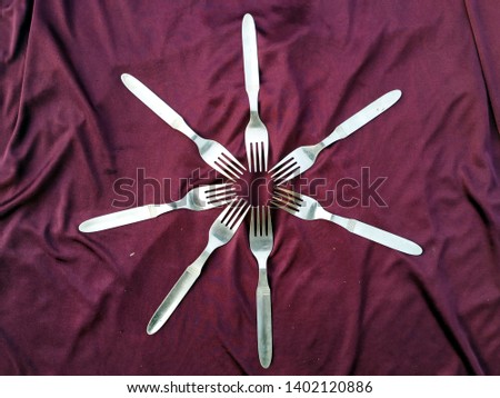 Empty Steel Fork isolated on violet background 