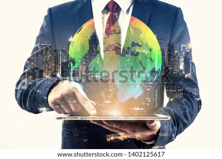 Double exposure of businessman using smart phone show globe simulation at office with city night background, digital network connection concept 