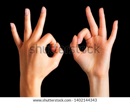 Set of woman hands holding gesture of okay or letter O on black background. Sign of success, victory or luck. Isolated with clipping path.