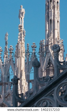Statues of the Duomo cathedral in Milan in the evening