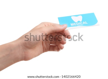 Woman holding business card isolated on white, closeup. Dental medical service