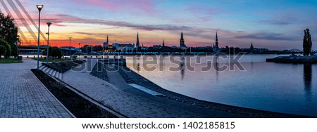 Panoramic image depicting historical district of Riga - the capital city of Latvia, it offers for tourists many resting opportunities as well as unique medieval buildings and Gothic style architecture