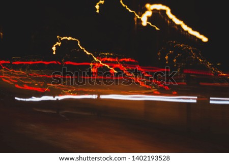 Urban abstract street lights. Chaotic colorful line lights. Abstract background. Irregular vector shapes. Cityscape game of lights.