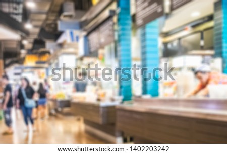 Defocused or blurred photo of food court in department store use for background