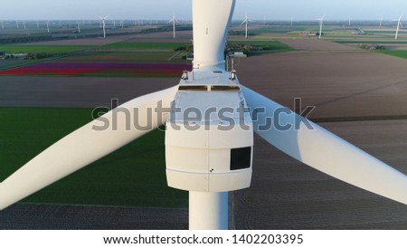 Aerial close up photo of wind turbine nacelle which is the housing on top of the energy converter is a device that converts the winds kinetic power into electrical electricity