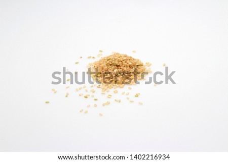 Heap of brown rice on white background - Image