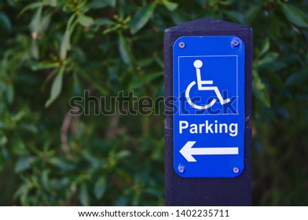 Parking for disabled people sign in blue rectangular shape display
