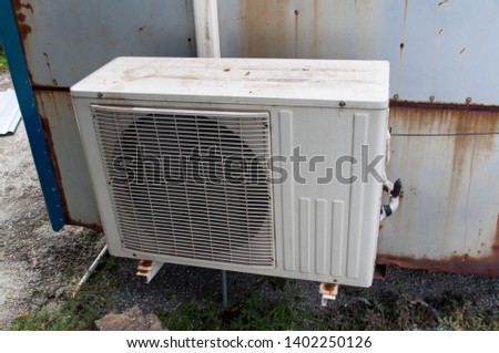 Old air conditioning system installed on the container.