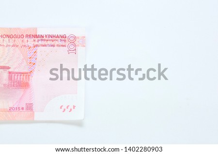 Cash of China money RMB100 on white background. Selective focus.