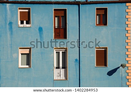 window on the blue building facade in Bilbao city Spain, window in the street