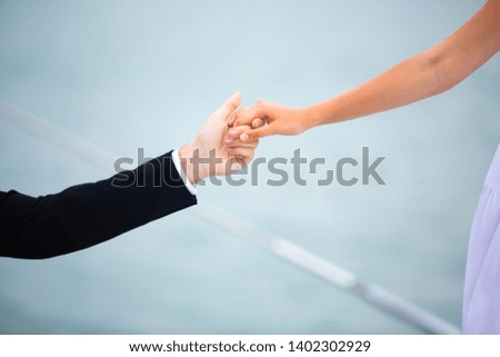 Close up of  Woman and man giving hand in love concept