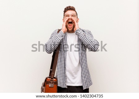 Young modern business man shouting excited to front.