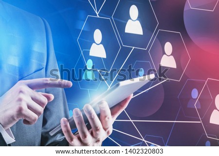 Hands of man in formal clothes using digital tablet with social connection screen behind him. Concept of people interaction in business. Toned image