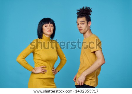   young couple on a blue background                            