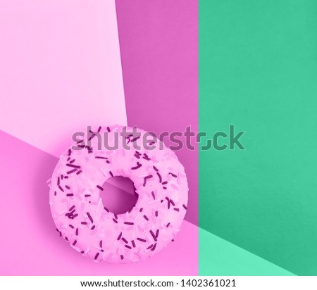 Delicious donuts on light pastel color background. National Donut Day concept.