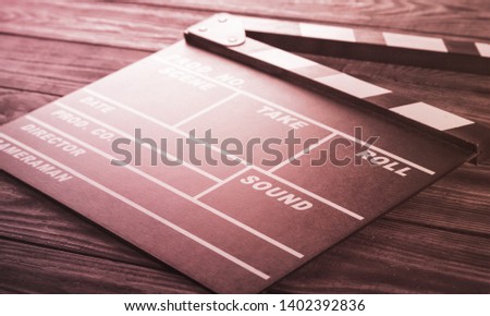 Clap board on wooden background