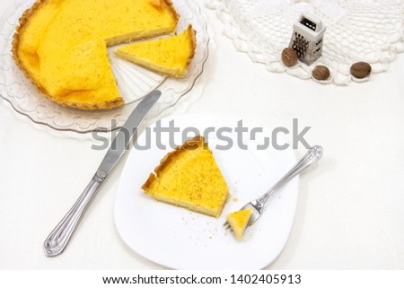 Sweet custard tart or lemon pie white background. Selective focus. Close up.