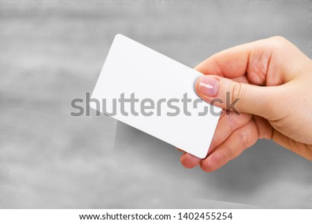 Hand hold blank translucent card mockup with rounded corners. Plain clear call-card mock up template holding arm. Plastic transparent acrylic namecard display front.