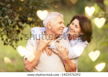 Portrait of Senior couple smiling in park