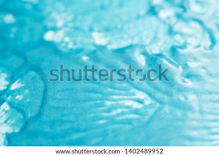 Abstract art texture background. Melting glaze design. Beautiful sky blue paint with shiny effect.