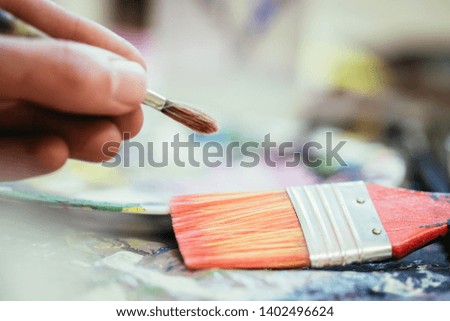 Artist paint brush on painting background. Painting therapy. 
