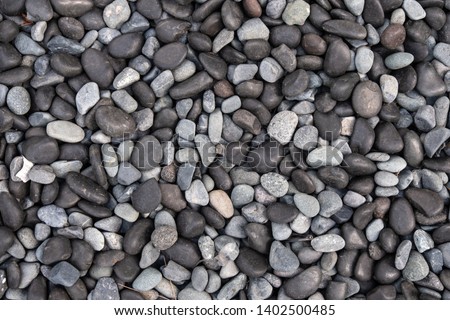 Black and white pebbles for background and texture. Rock or stone pebble is sign of spa and zen religion.