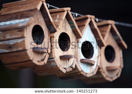 row of wooden bird house.