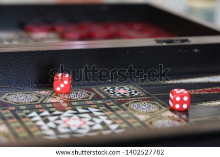 Dice and a backgammon board.