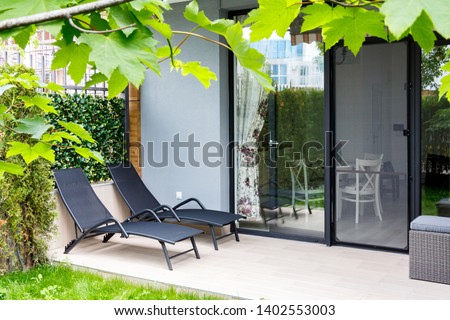 lounges in the backyard garden Royalty-Free Stock Photo #1402553003
