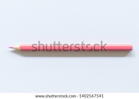 pink colored pencil  One single object, top view, bright tint.