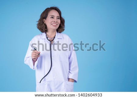 Asian beautiful pretty mid age female doctor in white coat blouse, on blight blue background