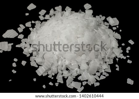 Caustic soda,Sodium Hydroxide isolate on black background Royalty-Free Stock Photo #1402610444