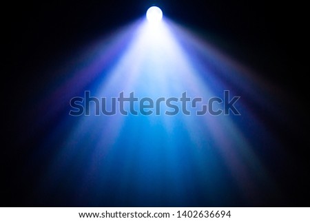 beautiful rainbow color spotlight wide lens projector with light beam for film movie and cinema at night . abstract smoke texture . screening for multimedia . black background . Royalty-Free Stock Photo #1402636694