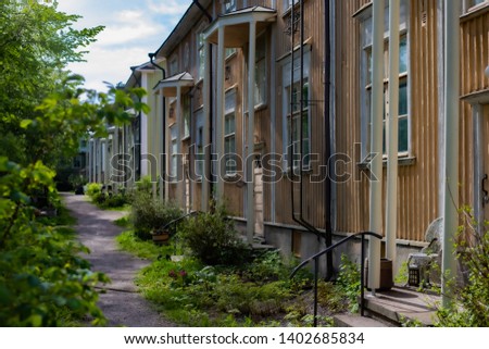 Beautiful old wooden colorful houses at the row in Finland, Helsinki.