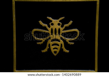 Bee symbol. metal icon artwork
