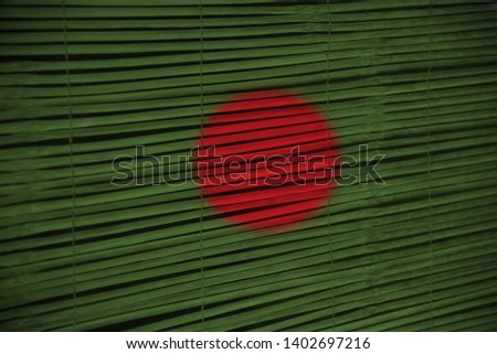 Bangladeshi national flag textures painted on a bamboo surface