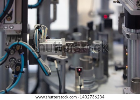 Industrail Robotic Arm installed in machine factory using as automation system. Industrial and technology for modern line production in a factory. Royalty-Free Stock Photo #1402736234