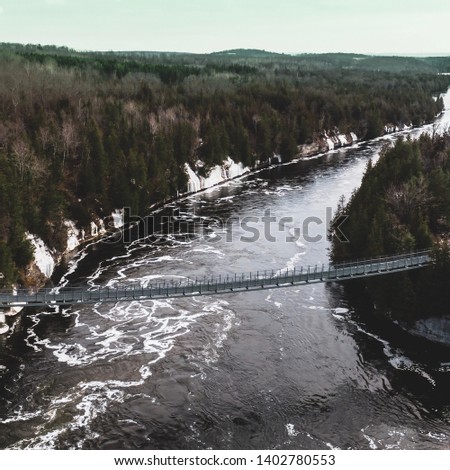 Suspension Bridge above raging rapids