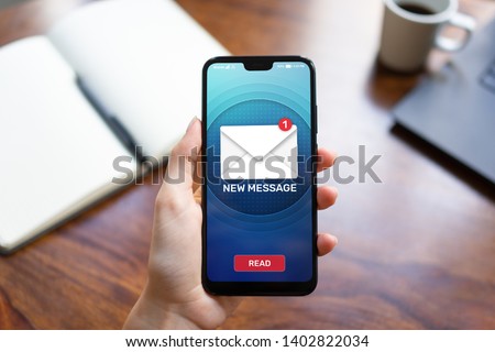 New message icons on mobile phone screen. Business communication, internet and technology concept. Royalty-Free Stock Photo #1402822034