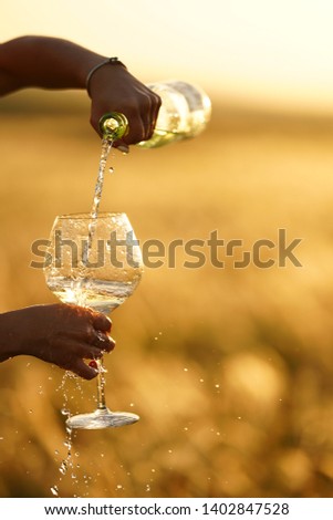 champagne in a glass at sunset