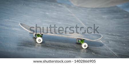 One skateboard on the road. Extreme sport challenge and skateboarder competition, close up picture of skate