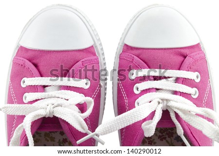 Close up of a pair of sneakers on white background.
