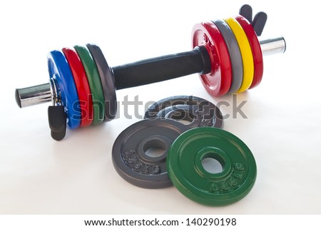 Picture of a weight with accessories on a white background.